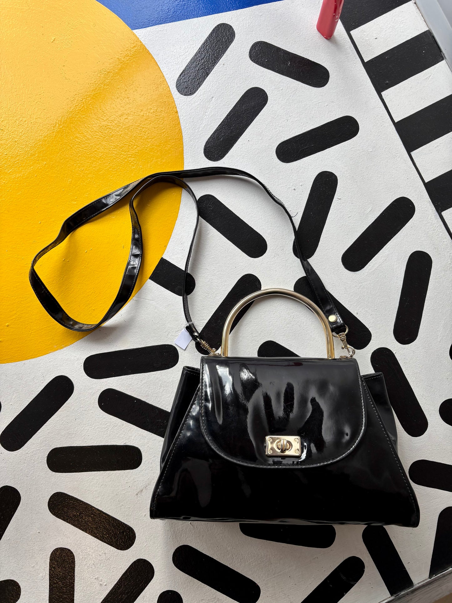 Black shiny purse with clasp