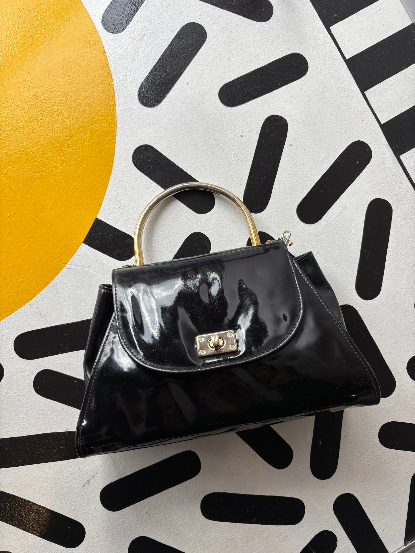 Black shiny purse with clasp