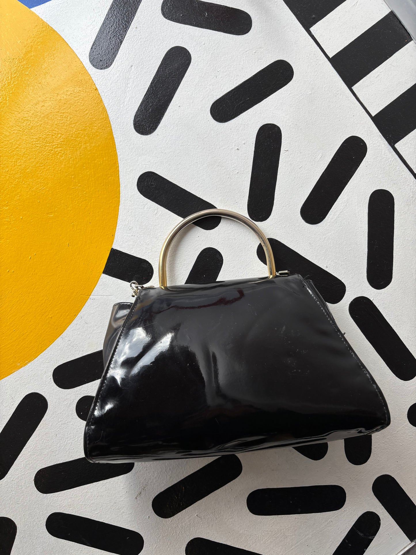 Black shiny purse with clasp